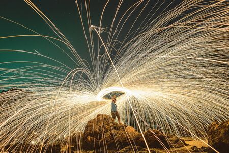 Burning steel wool on stone.