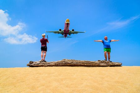 PHUKET, THAILAND - March 25, 2016 : Tourist enjoying with landing plane on the beach in summer day.のeditorial素材