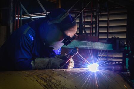 Welding steel structures and bright sparks with lens flare