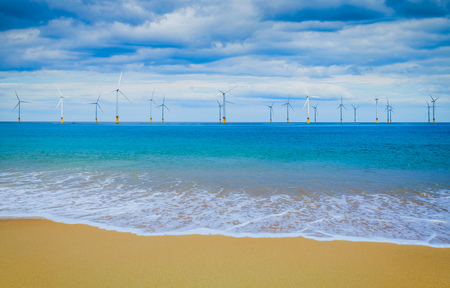 Offshore Wind Turbine in a Wind farm under construction off coast of Englandの写真素材