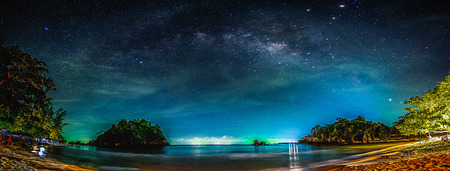 Landscape with Milky way galaxy. Night sky with stars and sea.の写真素材