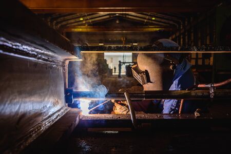 Welding steel structures and bright sparks in construction industry.の写真素材