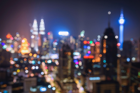Blurred abstract background lights, beautiful cityscape view of Kuala lumpur city skyline at night in Malaysia.の写真素材