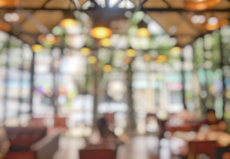 Blurred image coffee shop with abstract bokeh light background. Vintage toneの写真素材