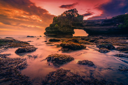 Tanah Lot Temple on sea at sunset in Bali Island, Indonesia.の写真素材