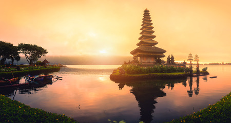 Pura Ulun Danu Bratan, Hindu temple with boat on Bratan lake landscape at sunrise in Bali, Indonesia.の写真素材