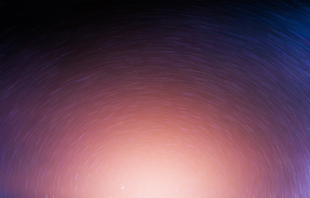 Landscape of Long exposure stars trails with polaris and sunrise.の写真素材