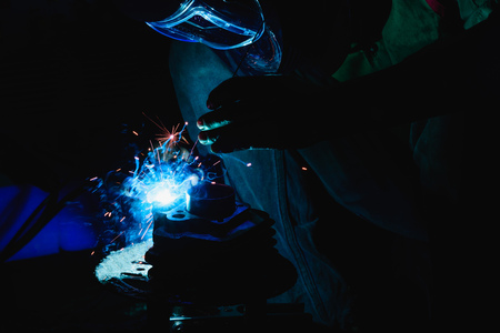 Welding steel structures and bright sparks in steel construction industry.