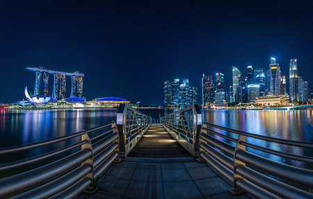 SINGAPORE-APRIL 29, 2016: Singapore Skyline and view of skyscrapers on Marina Bay at twilight time.のeditorial素材