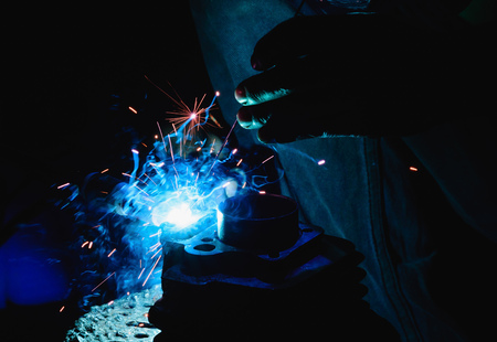 Welding steel structures and bright sparks in steel construction industry.の写真素材