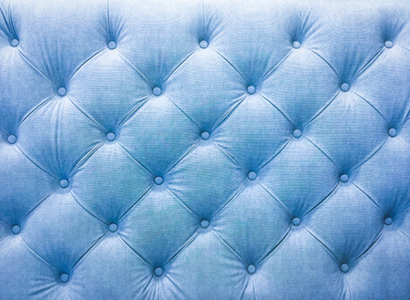 Upholstery sofa fabric with rivets. Blue tone.の写真素材