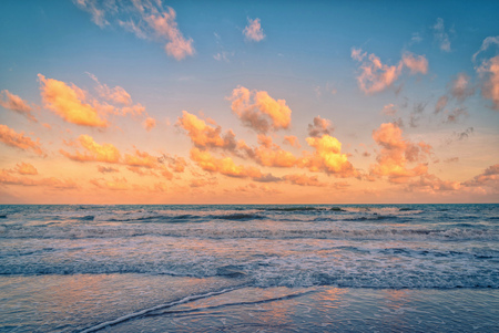 Beautiful clouds with sunset over the sea.の写真素材