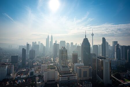 Cityscape of Kuala lumpur city skyline on blue sky with sunlight in Malaysia at daytime.の写真素材