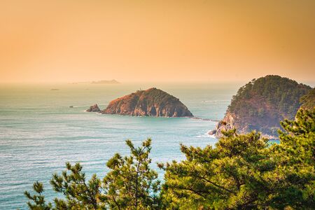 Island near Songdo beach at sunset in Busan, South Gyeongsang Province, South Korea.の写真素材