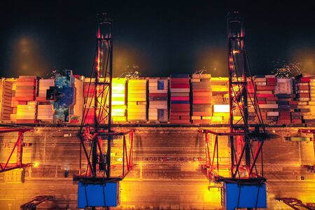Aerial view of Container port terminal at twilight in Hong Kong.