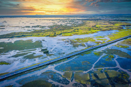 Aerial view of Chalerm Phra Kiat road at daytime in Thale Noi, Phatthalung, Thailandの写真素材
