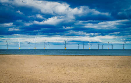 Offshore Wind Turbine in a Windfarm under construction off the England Coastの写真素材