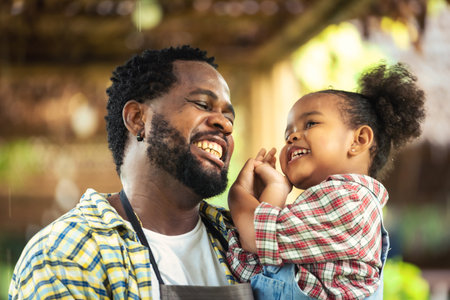 Portrait of Smiling African man farmer and children in farmの写真素材