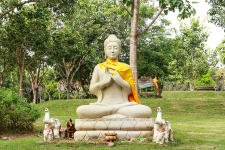 Buddha statues in the park, outdoors under the shade trees at Wat Phra That Na Dun.,  Province Mahasarakham , Thailand.の写真素材