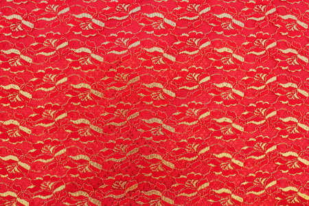 flower pattern on a piece of red cloth.の写真素材