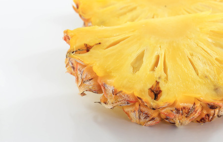Pineapple yellow resting on a white background.の写真素材