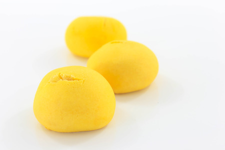 Three yellow sweet bread that is placed on a white background.の写真素材