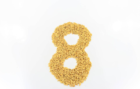 Jasmine rice arranged a number eight on white background.の写真素材