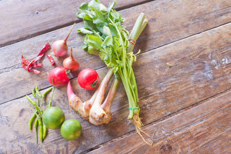 Spices and vegetables that on wooden floors.の写真素材