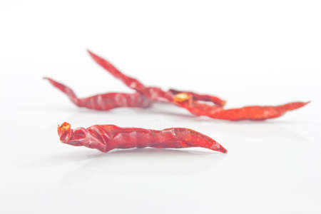 Dried paprika that is placed on a white background.の写真素材