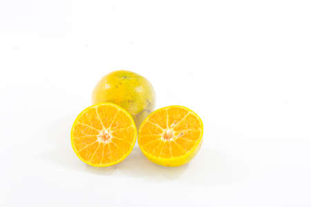 Mandarine orange that is placed on a white background.の写真素材