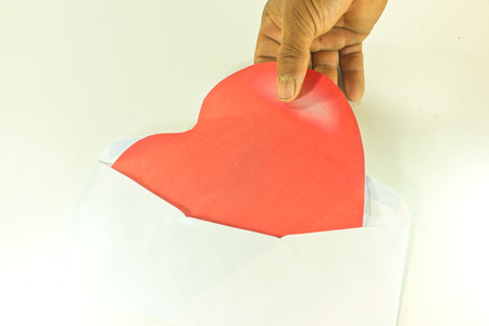 Heart in a white envelope to symbolize love on Valentine's Day.