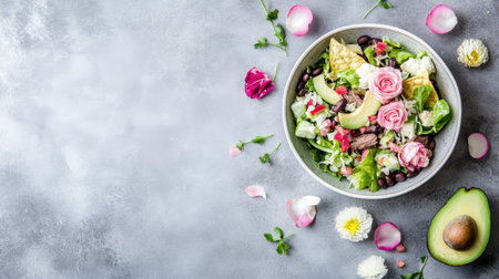 Mexican beef taco salad in bowl with healthy ingredients romaine lettuce, avocado, salsa, black beans and tortilla chipsの素材