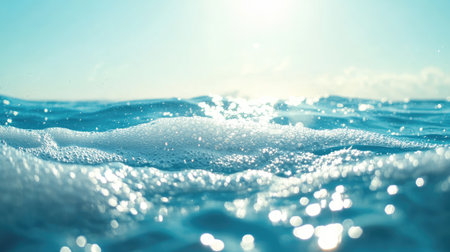 Macro shot of soap suds on a blue water background, light catching the foam to create a shiny, clean texture.の素材