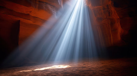 Vertical shafts of light illuminating canyon floor in Antelope Canyon, with rich red tones and elegant stone texturesの素材