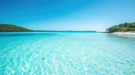 A picturesque lagoon with turquoise water and white sandy beaches under a clear blue sky.の素材