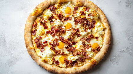 Top view of a breakfast pizza with crispy bacon, scrambled eggs, and mozzarella cheese, on a light and fluffy crust.の素材