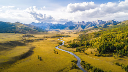 Stunning aerial view of a peaceful mountain landscape featuring a winding river, lush forests, and majestic peaks under a bright sky. Perfect for nature enthusiasts.の素材
