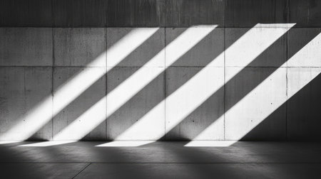 Black and white image featuring diagonal shadows on a concrete wall, creating a minimalist and modern atmosphere. Perfect for design and architecture themes.の素材