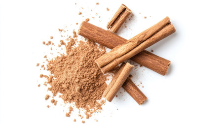 A collection of cinnamon sticks and ground powder on a clean white background. Perfect for culinary, baking, or herbal uses. Enhance your dishes with this aromatic spice.の素材