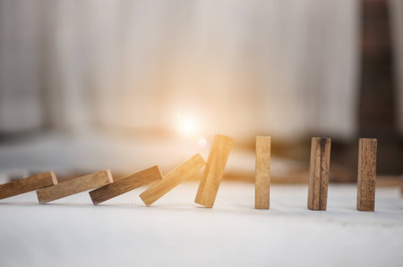 domino effect made up from wooden blocks shape toy.domino effect in business concept.the domino wooden effect concept for business.の写真素材