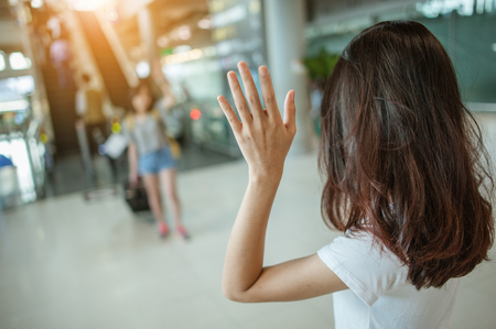 Asian girl Will be embracing friends from abroad.airports concept.airports hug.の写真素材