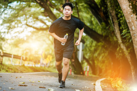 Active healthy runner jogging outdoor.の写真素材