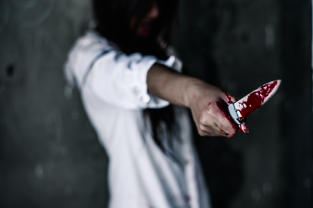 bloody hand of Ghost woman in the dark. nightmare, horror of scary fear on hell is monster devil in halloween festival, copy space the rightの写真素材