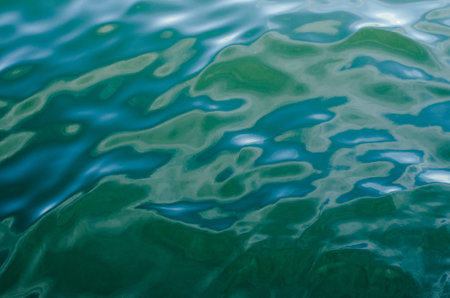 Light playing on the sea surface Water Sea Water background Blue water Abstract blue water