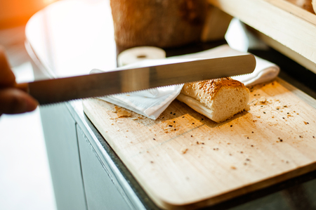 Bread on Slicing board with knife.breakfast.の写真素材