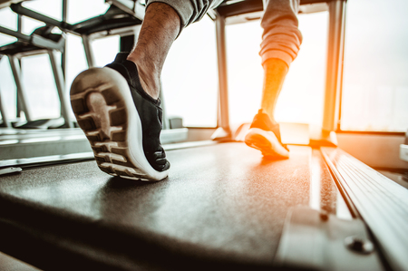 Close up on shoe,Man running in a gym on a treadmill.exercising concept.fitness and healthy lifestyleの写真素材