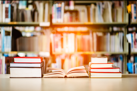 Book stack is placed on the library desk. education background, back to school concept.の写真素材