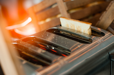 Closeup toaster with bread in kitchen.の写真素材