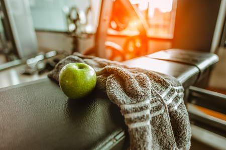 Apple with a towel in the fitness
. exercising concept.fitness and healthy lifestyleの写真素材