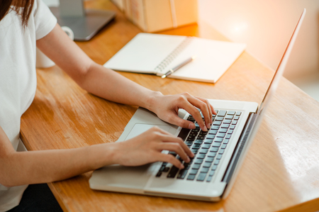 Young woman using laptop computer.の写真素材